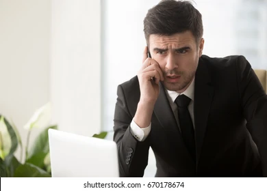 serious-worried-businessman-talking-on-260nw-670178674